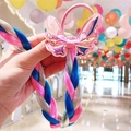 Detail of colorful braided hair extension with a laser pink glitter butterfly ornament - Sequin Bow