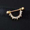 U-shaped gold nipple ring with sparkling crystal rhinestones on black leather background - Gold