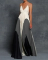 Detail view of the deep V-neckline and slim spaghetti straps on this pleated maxi dress - S / Gray