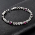 Zilveren armband met ovale rode robijnen en witte zirkonia op zwart leer - Rode Korund & Zirconia Verzilverd (ca. 18 cm)