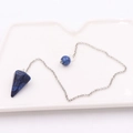 Macro detail of a conical blue stone pendant with gold flecks on a silver chain - Conical Stone + Silver Chain / Lapis Lazuli