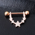 Rose gold starry moon nipple ring with sparkling crystals on black leather backdrop - Rose Gold
