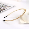 Elegant thin headband with amber and white crystals on a white ceramic cup - Single Row / Champagne