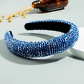Padded blue crystal headband featuring hand-beaded sparkling rhinestones on a thick band - Sapphire Blue