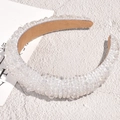 Detail of luxury baroque headband featuring hand-sewn crystals and iridescent beads - White