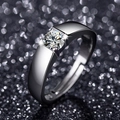 Macro shot of wide silver band ring with brilliant round cut solitaire stone in tension setting - Adjustable / Style 5 Men's Tension Set Ring (0.5 Carat)