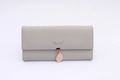 Detail showing high-quality gray leather wallet texture and pink leaf metal charm - Gray