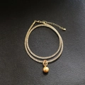 Collana a rete color champagne con pendente di perla e dettagli in zirconi lucidi - Collana / Oro (Con Ciondolo a Perla)
