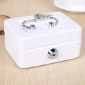 Close-up of white mini metal cash box with handle, key inserted, and 018 lock detail - White