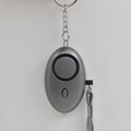 Grey personal alarm keychain with speaker and grey lanyard in an oval minimalist design - Gray
