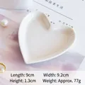 White heart-shaped ceramic dessert plate measuring 9x9.2cm with a smooth polished finish - White
