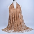 Detail of camel lace hijab scarf featuring intricate floral patterns and long tassels - 180cmx60cm / Camel
