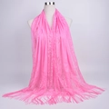 Close-up of pink lace shawl with delicate floral patterns and long fringe tassels - 180cmx60cm / Pink
