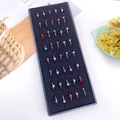 Detailed top view of 40-piece colorful crystal stainless steel nose rings in a storage box - Silver/AB Zirconia