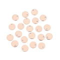 Close-up of twenty rose gold round stainless steel pendants with holes on white background - Inner Hole / 6mm / Rose Gold