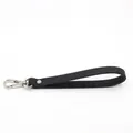 Close-up of black cross-grain leather wrist strap with polished silver metal hook - Black