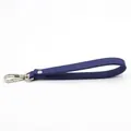 Detail view of navy blue crosshatch leather wristlet strap with silver lobster clasp - Bright Blue
