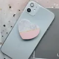 Heart-shaped marble and pink拼接 collapsible phone socket grip on blue smartphone - 21 Heart Marble Series-Pink White Splicing