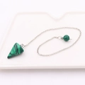 Macro detail of a conical green malachite stone pendant on a silver link chain - Conical Stone + Silver Chain / Malachite