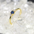 Gold plated ring with deep blue zircon center stone and transparent side accents - US 6 / Gold / Royal Blue Zircon