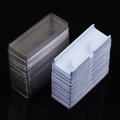 Bulk clear and white false eyelash inner trays stacked on a sleek black background - 60 Sets (With Clear Lid) / White