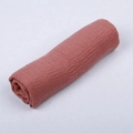 Brick red cotton linen blend scarf with fringe edges in a soft rolled display - Dusky Pink
