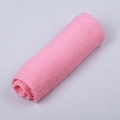 Pink crinkle cotton scarf featuring a textured pleated design in a rolled display - Bright Pink