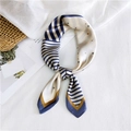 Striped scarf with star pattern in navy and beige, elegantly styled on textured white fabric - Star Stripes Blue
