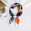 Elegant geometric print silk scarf with vibrant orange and blue abstract patterns - White Border Geometric