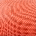 Elegant orange linen fascinator headpiece featuring intricate woven fabric texture - Coral