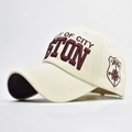 Detail of 3D embroidery and side shield patch on cream cotton baseball cap - Adjustable / Beige