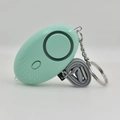Light green personal alarm keychain with grey lanyard and LED light for safety - Green
