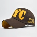 Close-up of distressed brim detail and yellow NYC felt embroidery on dark brown cotton cap - Adjustable / NYC Coffee