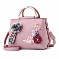 Pink lychee texture crossbody bag with 3D floral accents and gold metal handles - Light Pink
