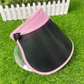 Pink sun visor hat with black wide brim and embossed detail on green lawn background - M (56-58cm) / Pink