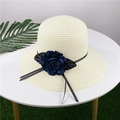 Women's summer straw sun hat with wide brim and decorative navy blue fabric flower - M (56-58cm) / Creamy White