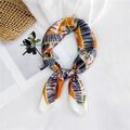 Vibrant orange and purple tropical leaf print silk scarf styled with a summer straw bag - Orange Banana Leaf
