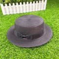 Detail view of the fine straw weave and black ribbon bow on a classic boater hat - M / With Bow / Black