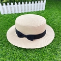 Top view of beige straw boater hat with a black bow ribbon on artificial turf - M / Without Bow / Beige