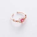 Macro detail of rose gold ring with heart-shaped pink stone and flower accents - 17#12959