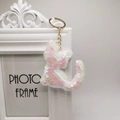 Cute cat sequin keychain with white and pink flip sequins on golden ring holder - White