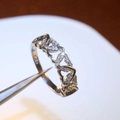 Exquisite silver-colored band with linked hollow hearts and sparkling zircon stones - White