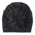 Close-up of baby turban hat featuring a large pleated fabric flower on black cotton knit - Black