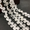 Macro shot of transparent crystal quartz teardrop beads for handmade jewelry making - 10mmx12mm / Natural White Crystal