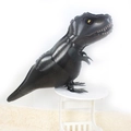 Black T-Rex dinosaur foil balloon standing on a small stool for birthday party decor - Walking Black T-Rex