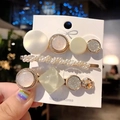 Set of four gold pearl and green acetate hair clips on a card held by a hand - 4#-Light Green Geometric Set