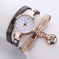 Stylish black leather multi-wrap watch with rose gold dial and dragonfly diamond charms - Winding Guitar Leaf Pendant / Black