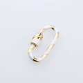 Macro shot of oval gold spiral screw clasp with white enamel finish jewelry detail - DM248-5 Oval White