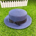 Close-up of blue-purple woven boater hat featuring a stylish black ribbon bow detail - M / With Bow / Navy Blue