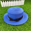 Close-up of a royal blue flat-top boater hat with a black grosgrain ribbon bow detail - M / With Bow / Royal Blue